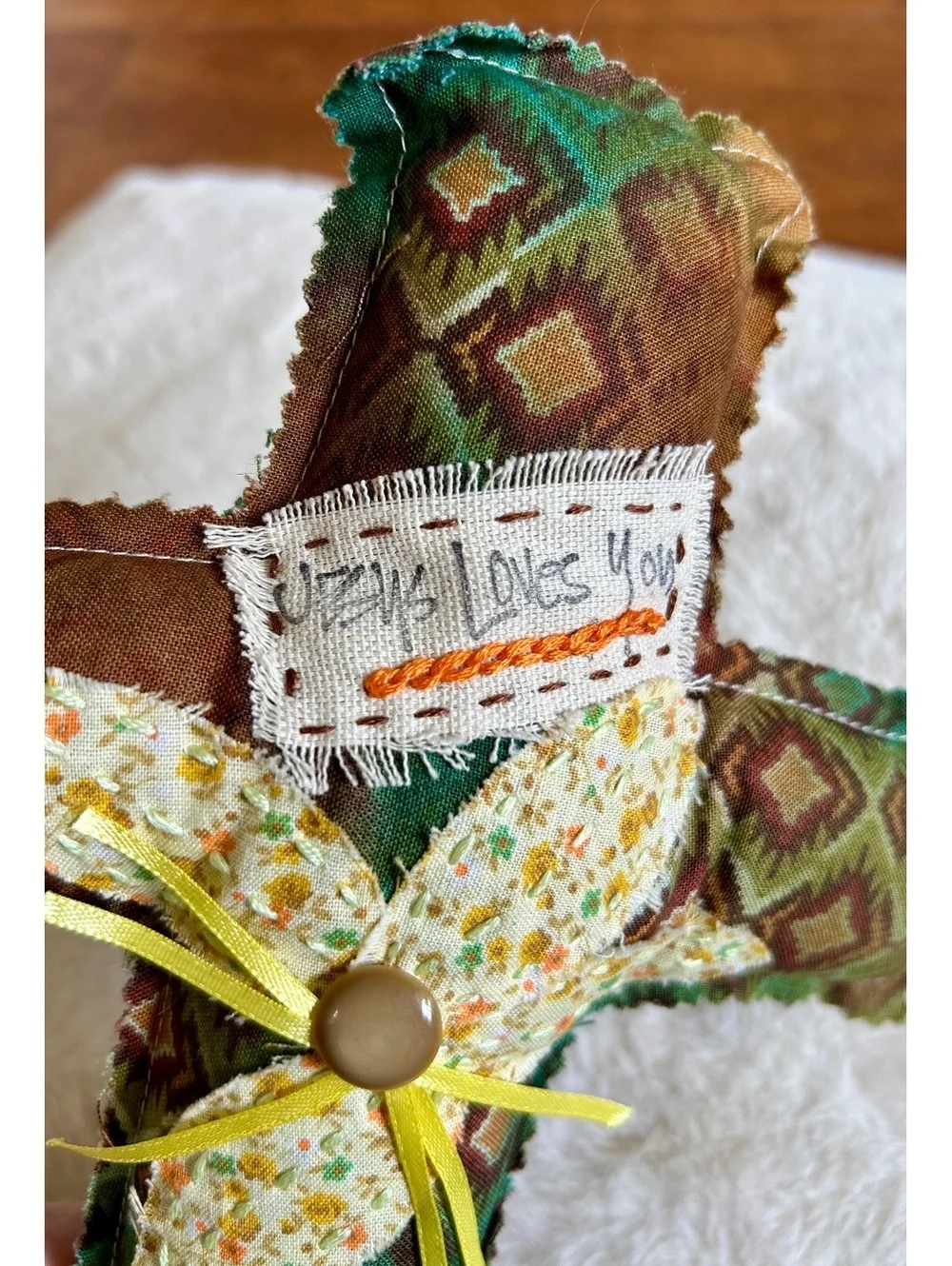 Handcrafted Decorative Fabric Cross with Floral Accent and 'Jesus Loves You' Tag